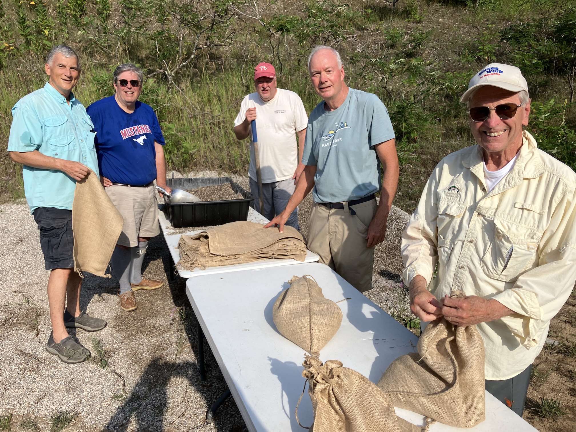 Group of men filling sandbags